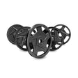 Five Black Mighty Grip Olympic Weight Plate Sets from Bells of Steel stand upright in a staggered line. They feature central star-shaped cutouts, matte finishes, precision grip handles, and clear weight markings for easy identification.