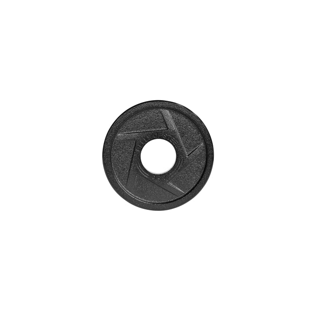 A black, round textured object looks like a camera lens cap with a central hole and geometric pattern, similar to precision grip handles on Bells of Steel's Black Mighty Grip Olympic Weight Plates. It's displayed against a plain white background.