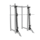 The Bells of Steel Smith Machine Rack Attachment features a sturdy metallic frame and an adjustable barbell, ideal for gym weightlifting exercises. Designed for stability and safety, this power rack ensures an optimal workout experience.