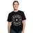 A smiling woman wears a black Bells of Steel Bamboo T-Shirt featuring a large white "BELLSOFSTEEL 25 KG" barbell plate graphic on the front, standing against a plain white background.