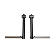 Two black metal Bells of Steel Camber Bar Attachments (Pair) with horizontal silver rods are positioned parallel to each other on a white background.