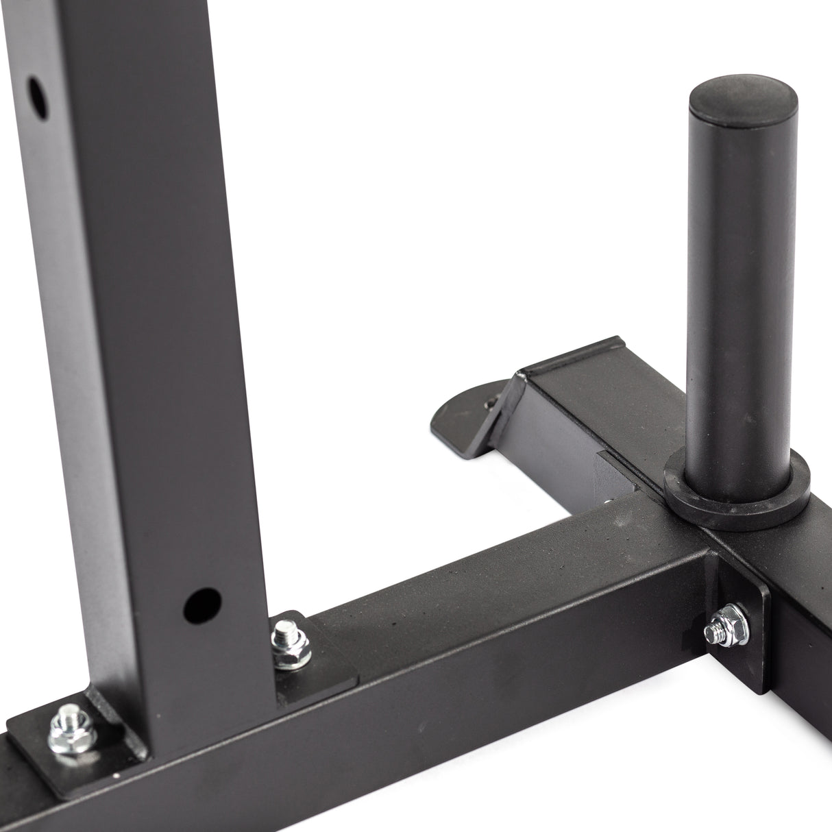 Close-up of a black metal frame with bolts, showing a vertical cylindrical post and flat horizontal support—part of the Bells of Steel Cable Crossover for 2.3" x 2.3" racks, designed as a weightlifting rack attachment for pulley systems.