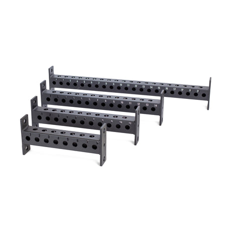 Four black metal Manticore Crossmembers by Bells of Steel, each with holes, numbered slots, and mounting plates on both ends, are arranged in a staggered row from shortest to longest on a white background.
