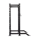 The Bells of Steel Hydra Collegiate Power Rack Builder, in black metal with a plain white background, features adjustable safety bars and multiple ⅝" holes for Hydra attachments. It supports various strength training exercises with its versatile modular components.