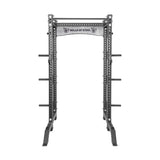 The Bells of Steel Manticore Collegiate Power Rack - Prebuilt (3" x 3", 1" Holes) features black and silver 3x3 uprights, customizable attachments, side weight plate storage, and a top logo sign—perfect for any home gym.