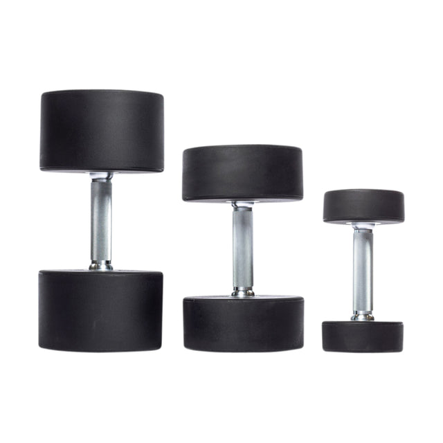 Three Bells of Steel Urethane Dumbbells with shiny silver handles and round black urethane weights are vertically aligned against a white background, illustrating their commercial-grade quality for fitness enthusiasts.