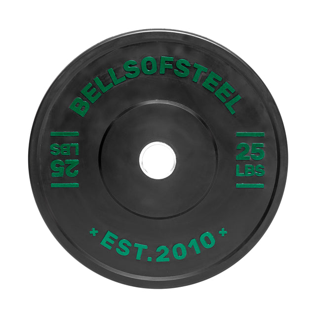 The Dead Bounce Conflict Bumper Plate features "BELLSOFSTEEL" and "25 LBS" in green text on a round black plate with "EST. 2010." Made of virgin rubber and stainless steel, it's perfect for weightlifting or bodybuilding.