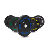 Five Bells of Steel Dead Bounce Conflict Bumper Plates in varying sizes with color-coded weight markings are arranged in a semi-circle, each displaying its weight, “BELLSOFSTEEL,” and featuring a durable stainless steel insert.