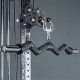 Close-up of the Bells of Steel Fat Bar - Olympic Curl Bar Cable Attachment, a black zigzag bar on a pulley system, designed to enhance grip strength. Set against a plain gray background.