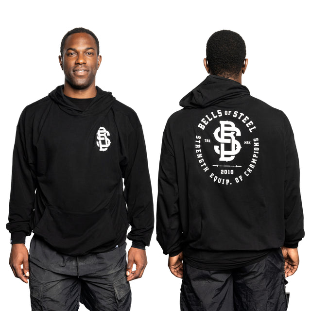 A man models a buttery soft "Bells of Steel" bamboo hoodie. The front features the logo and brand name, while the back showcases a large "Bells of Steel" design with "Strength Equip. of Champions" and "2010," emphasizing its sustainable bamboo material.