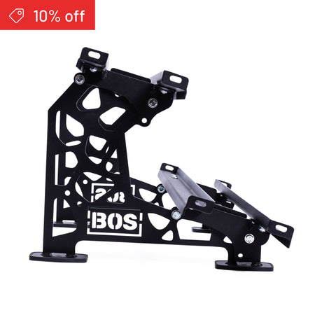 Black metal Bells of Steel Commercial Interchangeable Weight Rack with cut-out design and angled supports, shown on a white background. Includes a swappable storage shelf. A red "10% off" label with price tag icon appears in the top left corner.