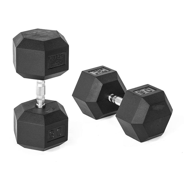 On a white background, two black Bells of Steel Ergo Rubber Hex Dumbbells are displayed; one stands upright and the other lies down showcasing weight markings. The textured silver handles ensure a secure grip, promising quality and durability with every lift.