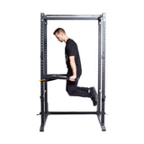 male model doing dips in a rack with Y Dip Bar Rack Attachment - 2.3" x 2.3"