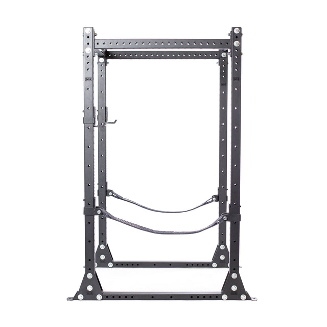The Bells of Steel Hydra Flat Foot Components is a black metal power rack with multiple adjustment holes, safety straps, and a sturdy rectangular frame with flat foot support for weightlifting and strength training.