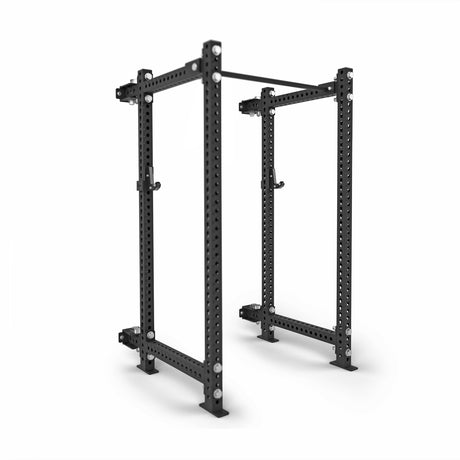 The Bells of Steel Manticore Folding Power Rack - Prebuilt features sturdy 3"x3" uprights, 1" holes for attachments, and a pull-up bar, making it ideal for weightlifting and strength training in your home gym.