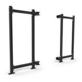 Two black Bells of Steel Manticore Folding Power Racks (prebuilt, 3"x3" uprights, 1" holes) stand upright on a white background. These sturdy racks are ideal for weightlifting or enhancing your home gym.