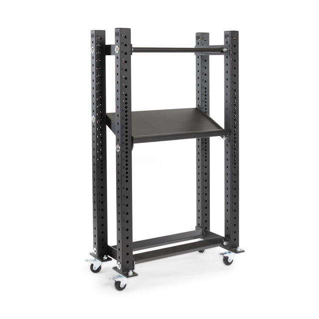 The Hydra Storage Builder by Bells of Steel is a modular system featuring two black shelves with perforated supports, mounted on four caster wheels for easy mobility—perfect for home gym storage.