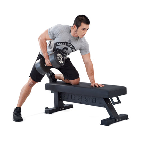 male athlete doing dumbbell rows with the Hero Heavy-Duty Weight Bench