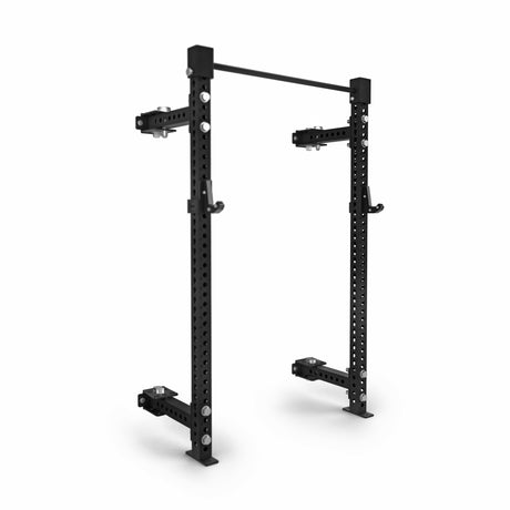The Bells of Steel Manticore Folding Half Rack (3" x 3", 1" holes) is a black metal power rack with adjustable safety arms and pull-up bar, perfect for weightlifting and strength training. Modular design allows easy height adjustments.