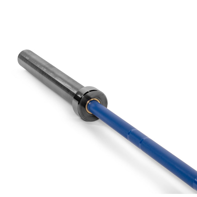 A close-up of the Bells of Steel Multi-Purpose Olympic Barbell – The Utility Bar features a blue shaft with notable knurling and a metallic grey sleeve. The detailed end cap beautifully showcases its design, making it perfect for weightlifting.