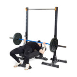 Male athlete doing barbell bench press using Hydra blue multi-purpose olympic barbell 