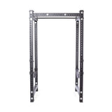 The Bells of Steel Hydra Four Post Power Rack Builder, featuring a sleek black metal design with four 3" x 3" posts and ⅝" holes for adjustable height, offers modular components. Its open frame suits home gym enthusiasts, pictured on a white background.