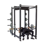 Male athlete doing bench press with Hydra Six Post Power Rack PREBUILT