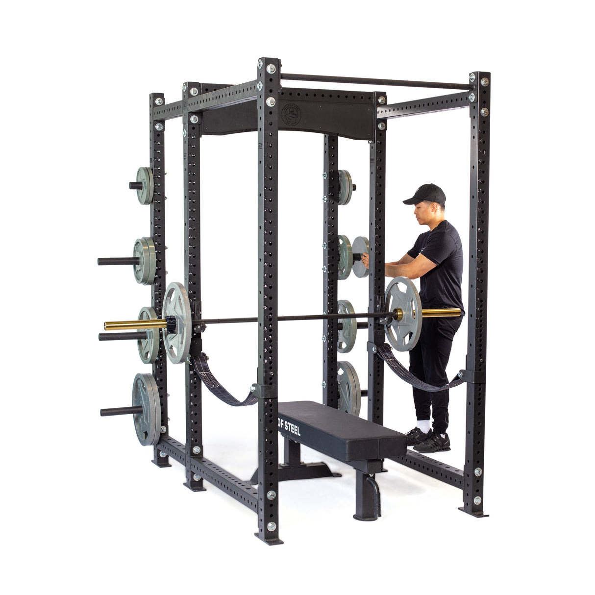 Model is loading weights onto the Hydra Six Post Power Rack PREBUILT