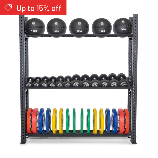 The Bells of Steel Hydra Storage Builder is a modular metal gym rack that holds medicine balls, dumbbells, and colorful weight plates. A red banner in the corner shows "Up to 15% off." Ideal for customizable home gym storage solutions.