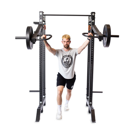 male model using lever arms rack attachment for strength training