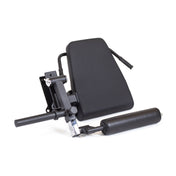 The Bells of Steel Leg Curl / Leg Extension Rack Attachment enhances workout versatility with its adjustable black incline bench accessory featuring a padded backrest, cylindrical roller, metal brackets, and handle for attachment.