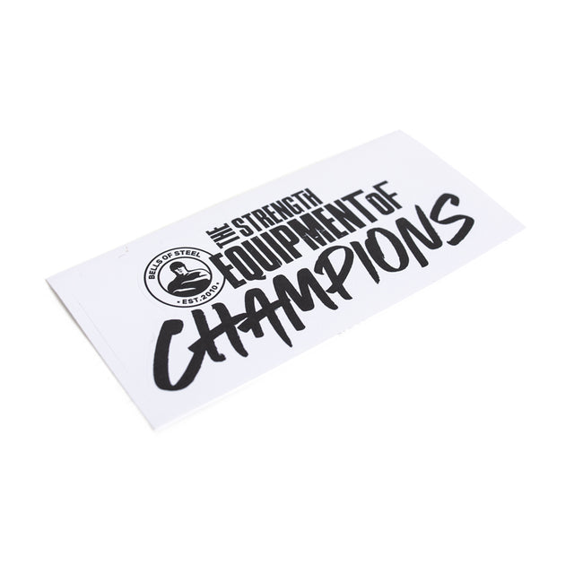 A Bells of Steel sticker features bold black lettering, "The Strength Equipment of Champions," on a white background with a crown in a round logo. Its durable design and quality adhesive ensure it stands proudly wherever placed.