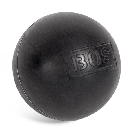 A solid black Bells of Steel Massage Ball, featuring "BOS" embossed on one side, designed for targeted muscle massage, is displayed against a white background.
