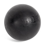 A black rubber Bells of Steel massage ball, used to relieve muscle knots, features "BOS" lettering on its matte surface and is shown on a white background.