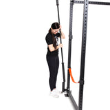 female athlete placing a barbell on the Vertical Mount Barbell Holder Rack Attachment