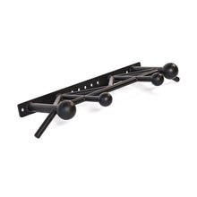 The Bells of Steel Globe Pull Up Bar is a black metal, wall-mounted coat rack with five round hooks in various sizes and an angular modern design. It features multiple mounting holes for secure installation.