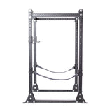 The Hydra Flat Foot Power Rack by Bells of Steel is a black, metal weightlifting rack featuring ⅝" adjustable holes and safety straps. Its sturdy 3" x 3" design, enhanced by Hydra attachments, makes it versatile for home or gym use. Set against a white background, it combines function with style.