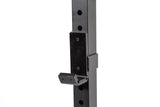 A close-up of a Bells of Steel J-cup attachment mounted on the Residential Power Rack (2.3" x 2.3", ⅝" holes), essential for securely holding a barbell during weightlifting in your home gym setup.