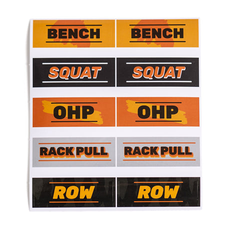 Bells of Steel Stickers: Durable, die-cut pairs labeled "BENCH," "SQUAT," "OHP," "RACK PULL," and "ROW" in bold text with orange, yellow, or black backgrounds—perfect for tracking your lifts.