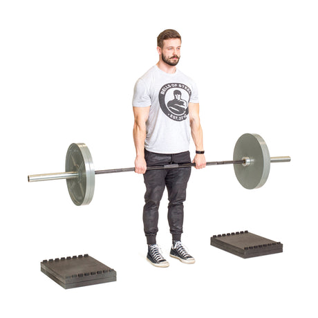 Male athlete using the Stackable Pull Blocks, designed for strength training and lifting.