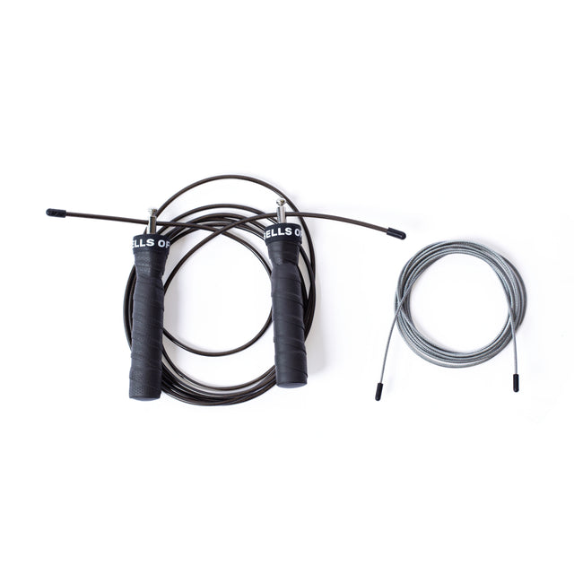 On the left, a Bells of Steel Jump Rope with ergonomic black handles and dark rope is coiled, while on the right an adjustable gray replacement rope awaits—ideal for cardio training.