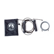 A black "Bells of Steel" pouch, an adjustable jump rope with ergonomic handles, and a coiled grey cable jump rope are arranged on a white surface, ideal for your cardio training needs.