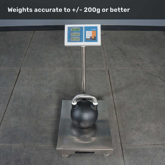 A Bells of Steel Competition Kettlebell rests on the platform of a digital scale, which clearly displays its weight for easy reference when using a kettlebell weight guide. Text above states, “Weights accurate to +/- 200g or better.” The scale is positioned on a tiled floor.