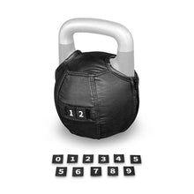 A Kettlebell Wrap by Bells of Steel USA, featuring black leather construction with an adjustable fit, a silver handle, and a patch showing the number 12. In front of the wrap, small black number tiles from 0 to 9 are displayed in two rows.