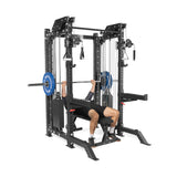 Someone is using THE KOLOSSOS - Smith Functional Trainer by Bells of Steel, featuring multiple weights and attachments, reminiscent of the Weight Stack Krakens, in a gym setting.