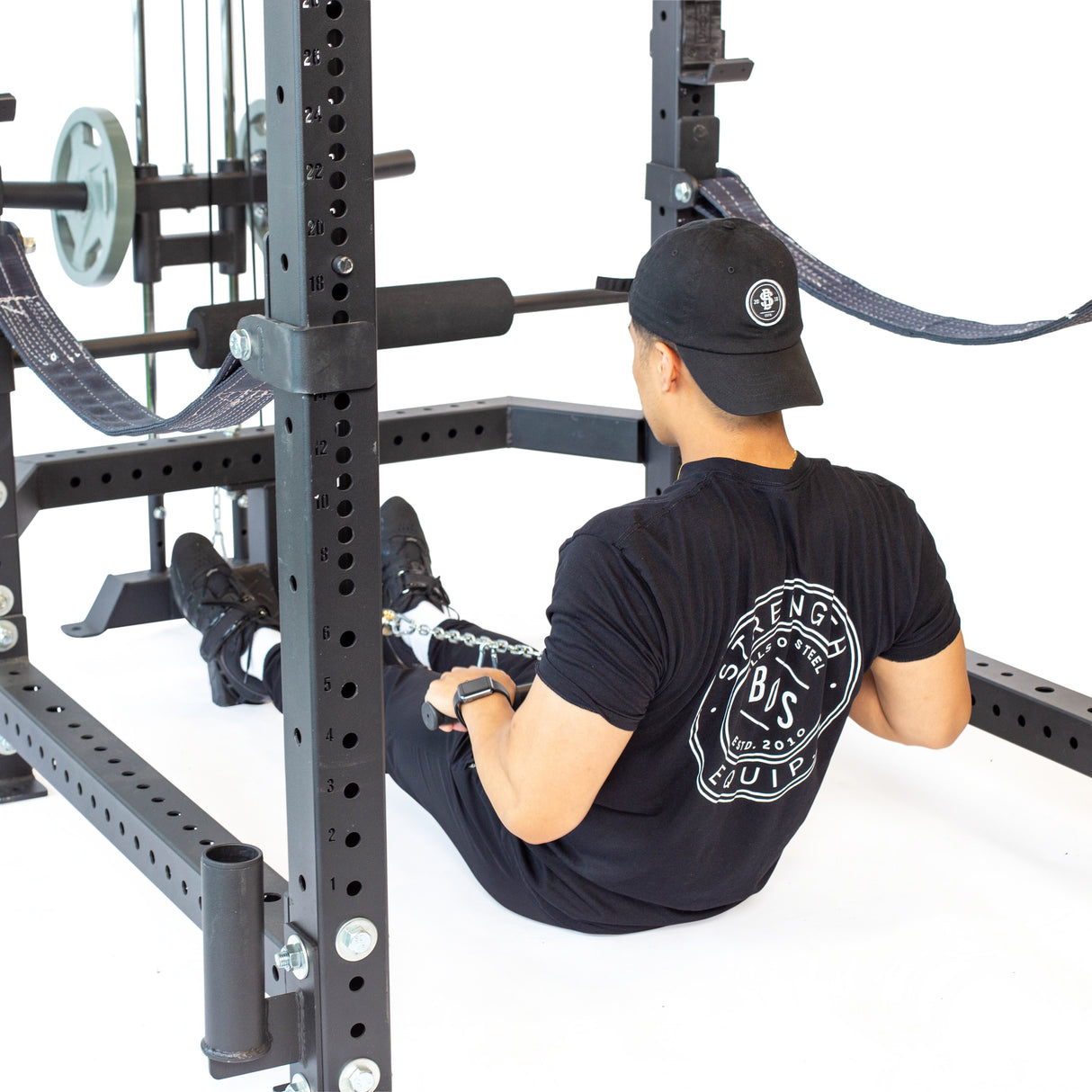 Male athlete doing seated row exercise using Plate-Loaded Lat Pulldown & Low Row Rack Attachment - Hydra