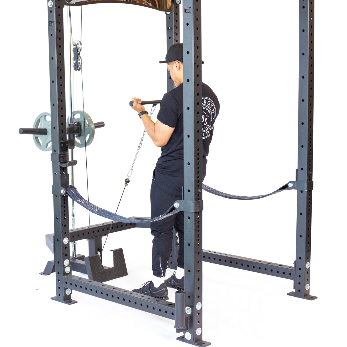 Male athlete doing standing cable row exercise using Plate-Loaded Lat Pulldown & Low Row Rack Attachment - Hydra