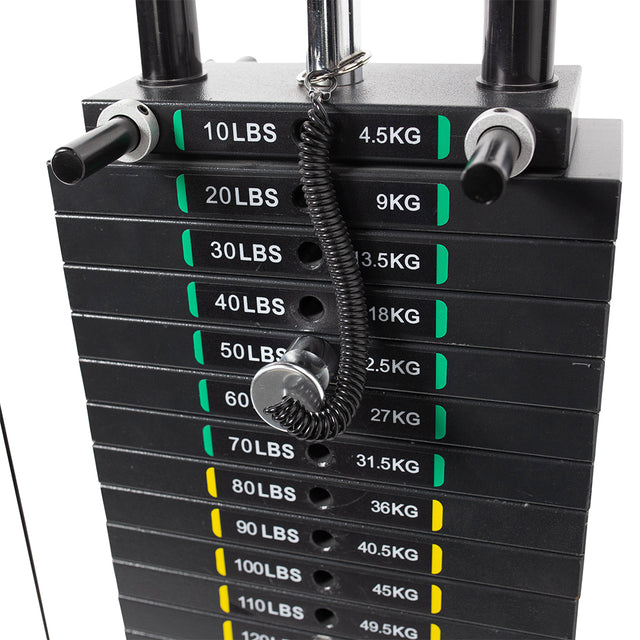 The Bells of Steel Lat Pulldown Low Row Machine features black weight plates labeled in pounds and kilograms, from 10 lbs/4.5 kg to 100 lbs/45.4 kg, perfect for your home gym. A pin with a coiled cable is inserted into the side of one plate for exercises like lat pulldowns.