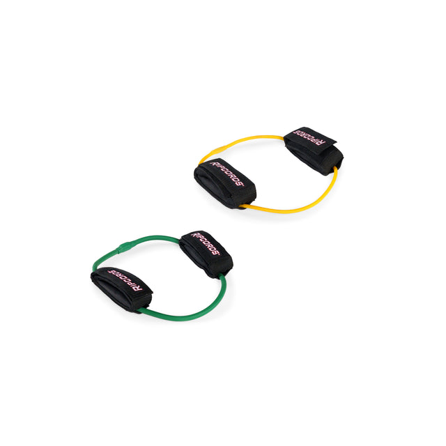 Two Human Trainer - Leg Cords by Bells of Steel USA, one yellow and one green, each featuring black padded ankle or wrist straps labeled “PROSPECS,” are designed as progressive tension leg bands for effective glute workouts and are shown on a white background.