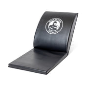 The Bells of Steel Luxury Sit Up Mat features a black, curved ergonomic design with lumbar support and comfort for core workouts.